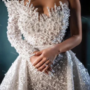 Captivating Elegance: A Review of Dubai’s Lavish Pearls Wedding Dress with Detachable Train