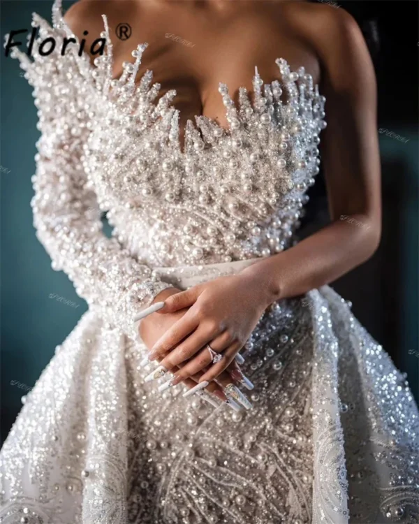 Captivating Elegance: A Review of Dubai's Lavish Pearls Wedding Dress with Detachable Train